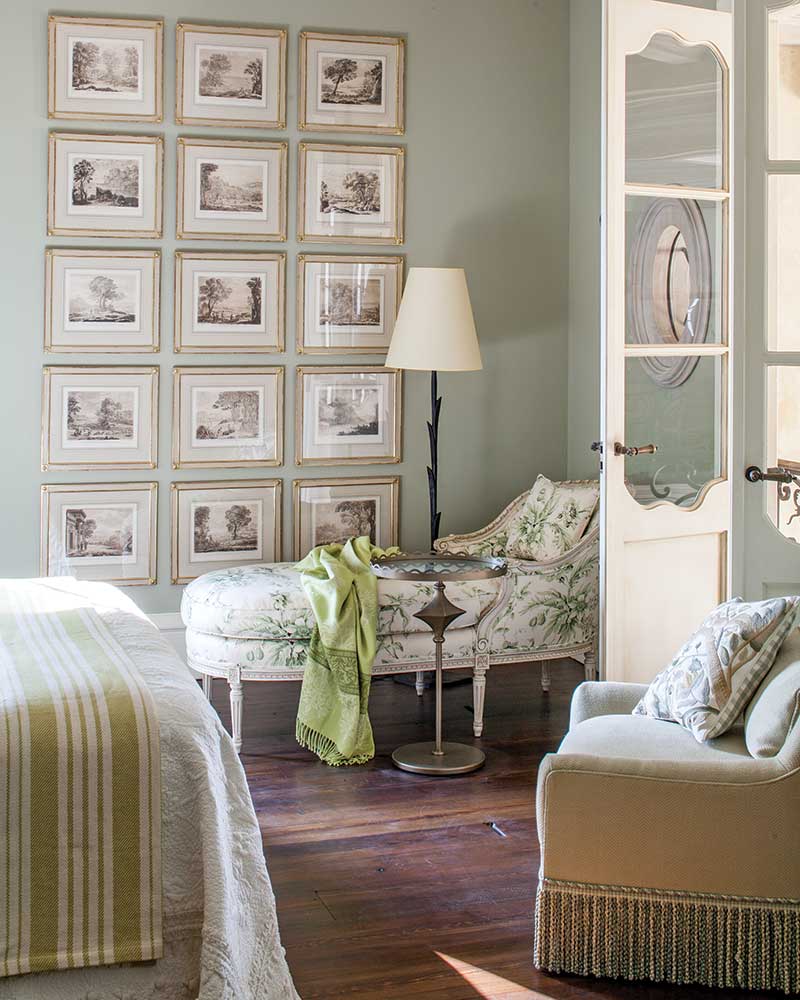 gallery wall in serene light green bedroom