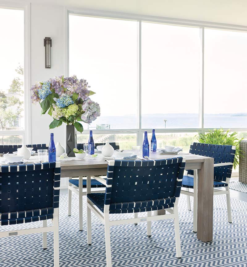 Blue and white outdoor tablescape with hydrangeas