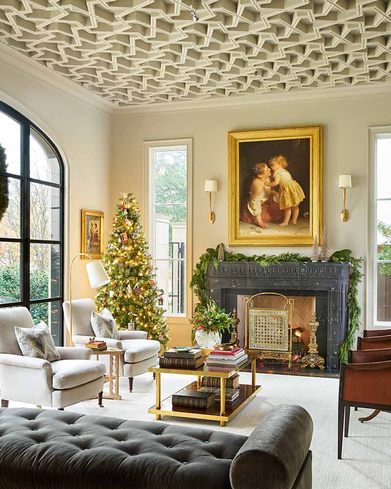 Luxury living room with Christmas tree and black mantel