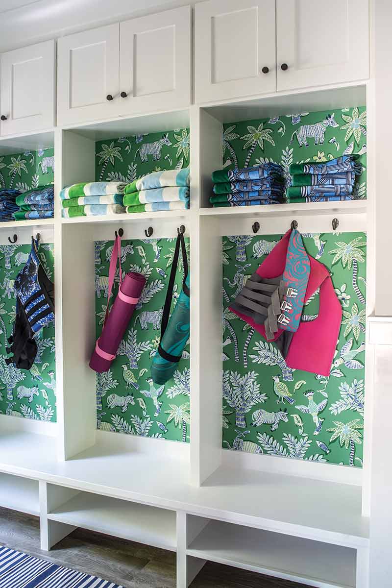 Key West vacation home mudroom with accent wallpaper