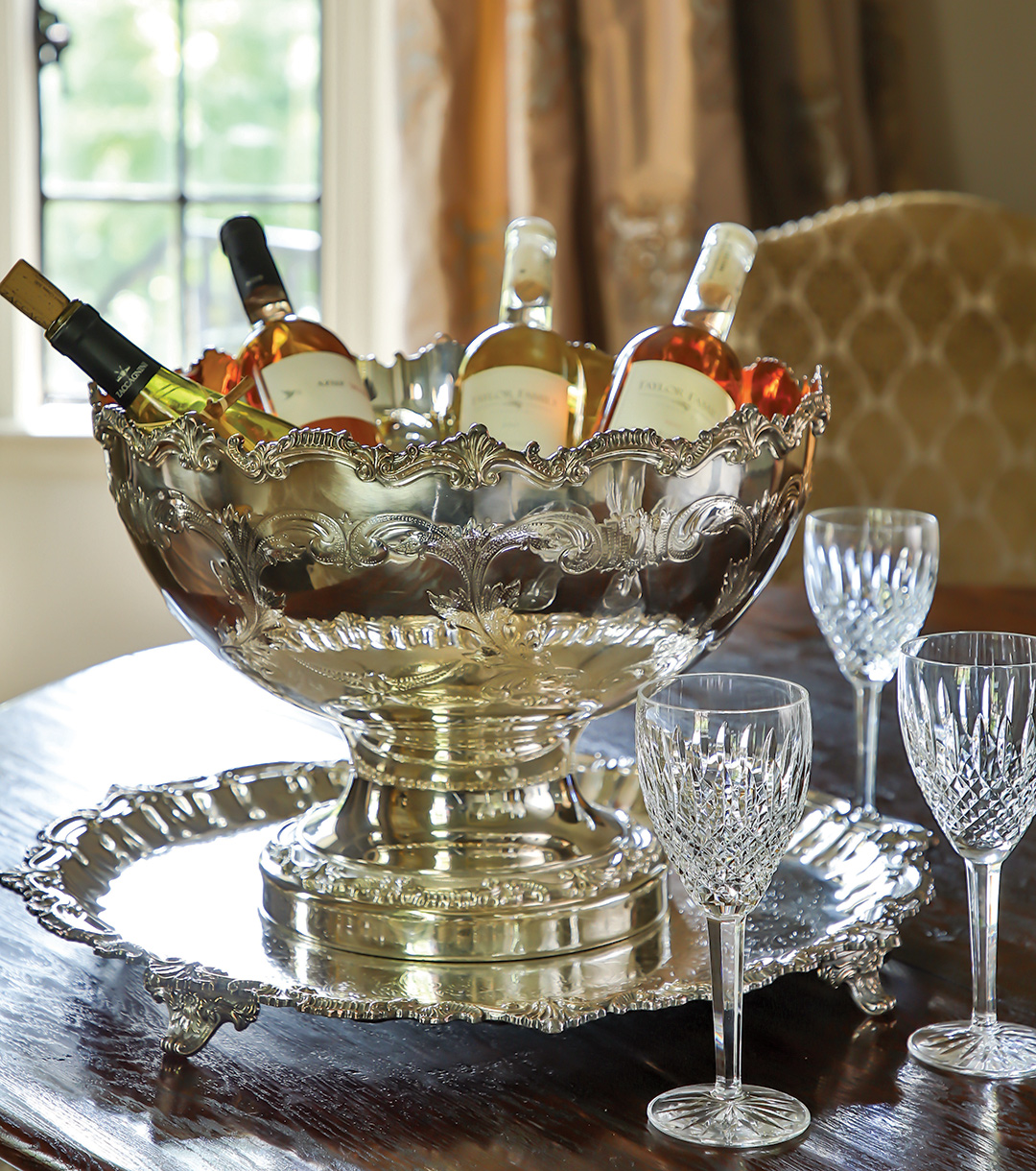 silver punch bowl filled with wine