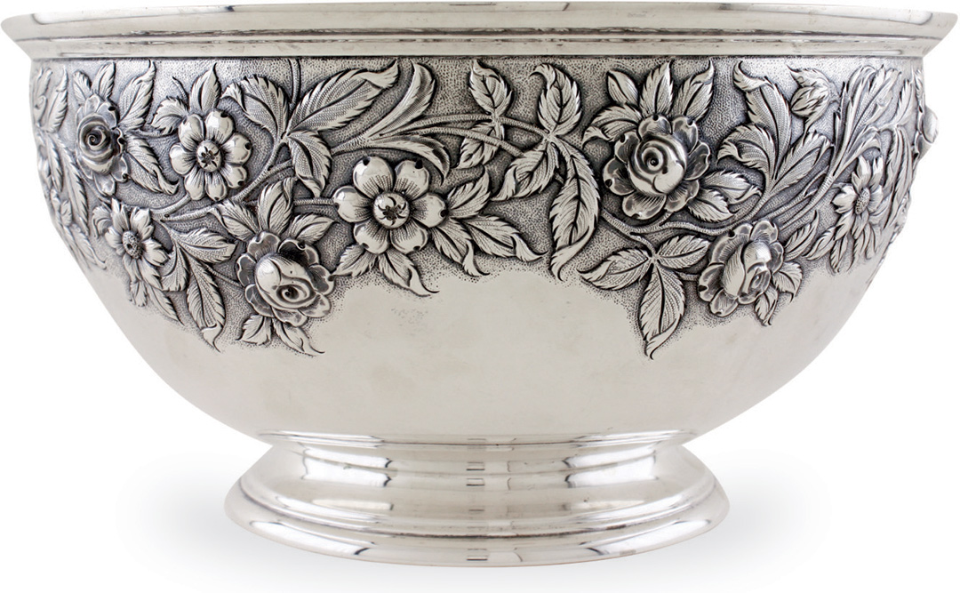 silver punch bowl with engraved floral design